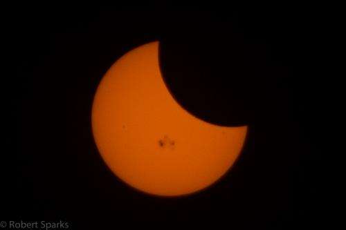 Partial solar eclipse shows off massive sunspot