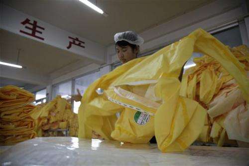 China factory whirs overtime to make Ebola suits