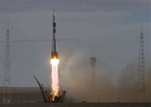 Soyuz carrying 3-man crew blasts off for orbiting station