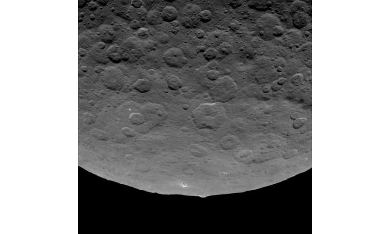 Is that a big crater on Pluto? Pyramidal mountain found on Ceres