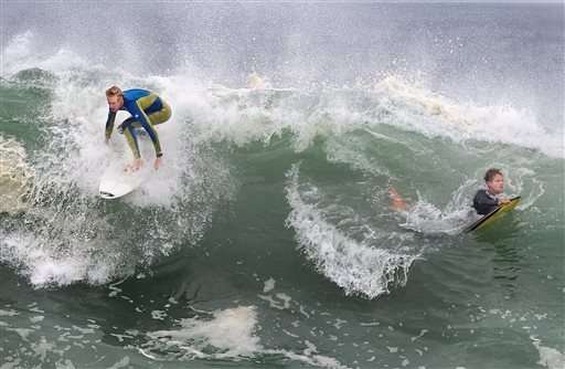 Huge waves in California lure bodysurfers, crowds to beaches