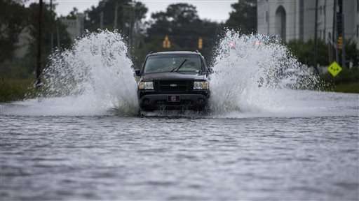 As world talks climate, US city fights flooding, sea rise