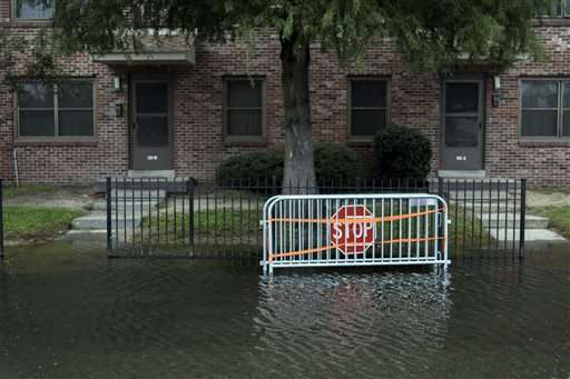 As world talks climate, US city fights flooding, sea rise