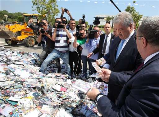 Algerian authorities destroy mountain of pirated CDs, DVDs