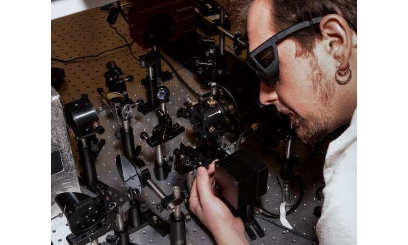Andrei Gorodetsky adjusts the optical system
