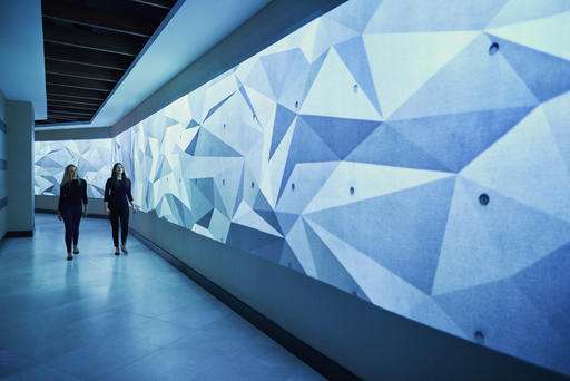 Interactive digital walls offer art and info in hotel lobby