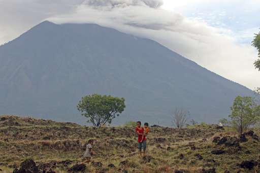 Bali volcano ash drifts 4.7 miles high, airport shut 3rd day