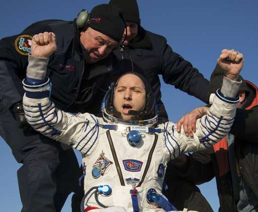 Space capsule with 3 astronauts returns to Earth