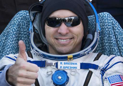 Space capsule with 3 astronauts returns to Earth