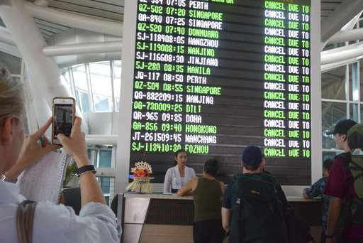 Bali volcano spits ash 2 ½ miles in the sky, airport closed