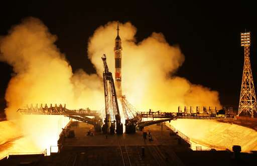 2 Americans, 1 Russian dock with International Space Station