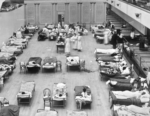 Century after pandemic, science takes its best shot at flu
