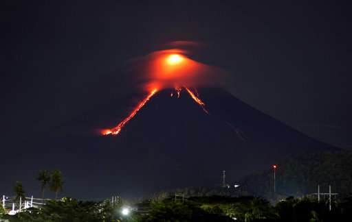 Glowing red lava causes more to flee from Philippine volcano