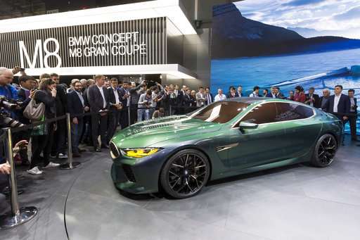 The Latest: Aston Martin combines luxury and electric power
