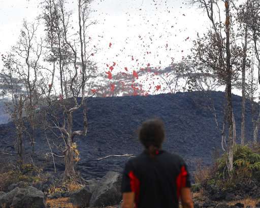 Hawaii officials airlift 4 residents after lava crosses road