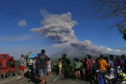 Philippine volcano spews lava fountains, 56,000 people flee