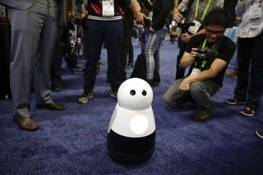 The Latest: Autos overshadow the small at CES tech show