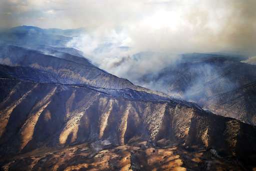 Fires menace US West, tornado touches Colorado wildfire site