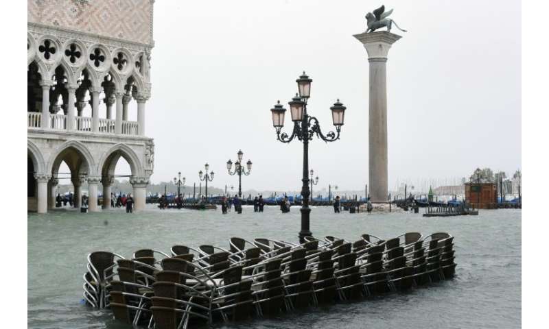 Chairs float in the flooded waters of Venice which have only topped 150 centimetres five times before in recorded history