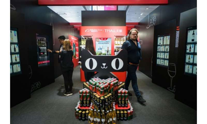 Customers browsed a pop-up shop stacked with wine bottles, billed by Alibaba as a way to show off its latest smart tech to retai
