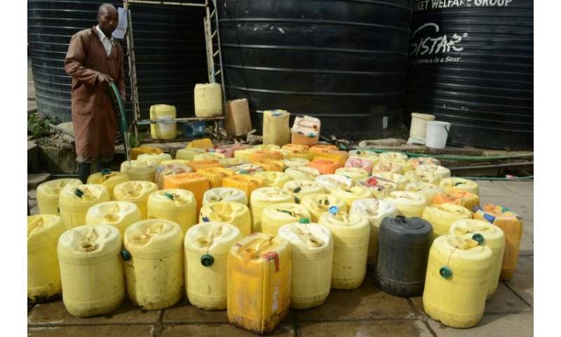 Waterboys supply water to butchers, fishmongers and restaurants in the crowded Kenyatta market