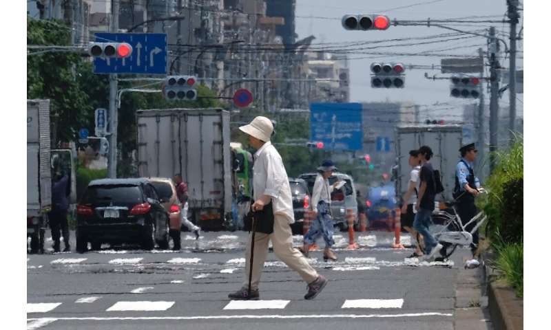 Heat haze distorts the background during a heatwave in Tokyo on July 31