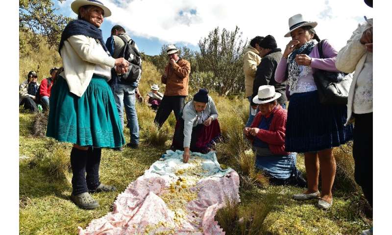 Indigenous people share a traditional lunch in Quimsacocha, Ecuador