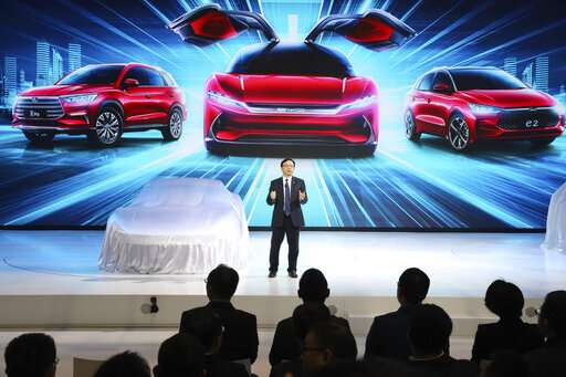 Electric car makers woo Chinese buyers with range, features