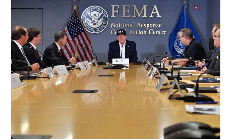 US President Donald Trump receives a briefing at the Federal Emergency Management Administration (FEMA) on Hurricane Dorian in W