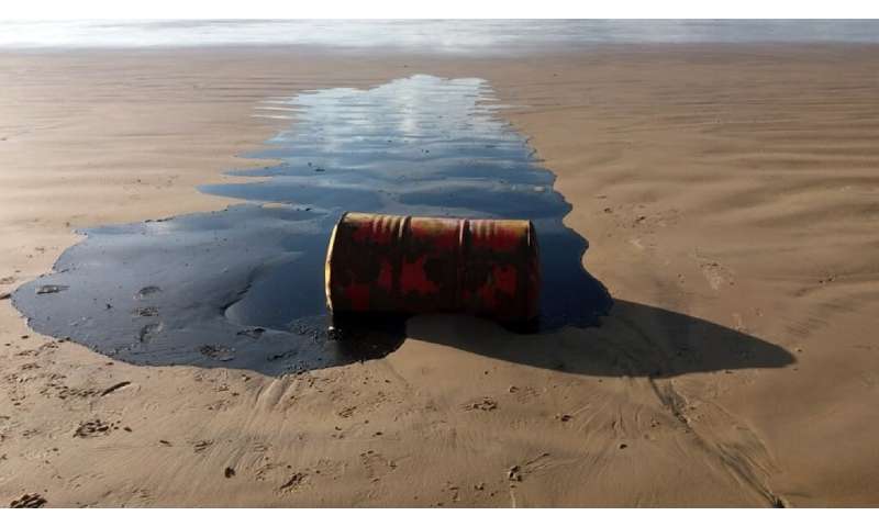 A barrel of oil spilled on a beach in Barra dos Coqueiros municipality, Sergipe state, Brazil, is pictured in September 2019 in 