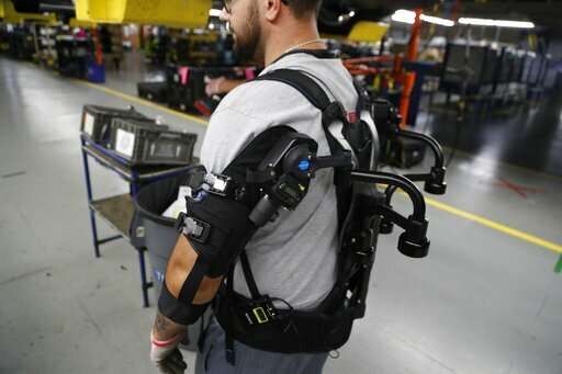 Companies hope vests will ease burden for assembly workers
