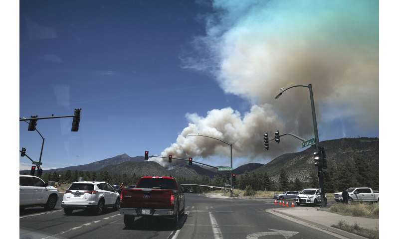 Arizona city watches, worries as mountain area burns