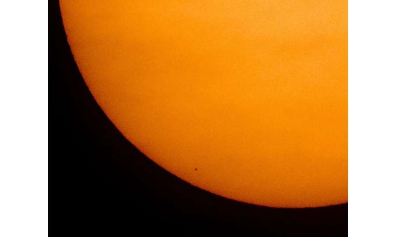 Mini Mercury skips across sun's vast glare in rare transit