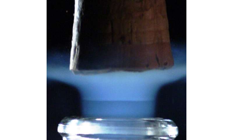 Champagne bottles found to create under-expanded supersonic CO2 freezing jets when uncorked