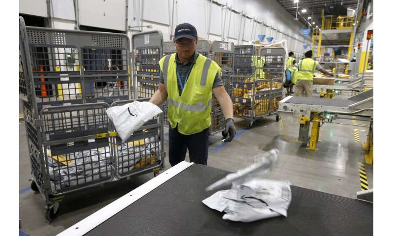 As robots take over warehousing, workers pushed to adapt