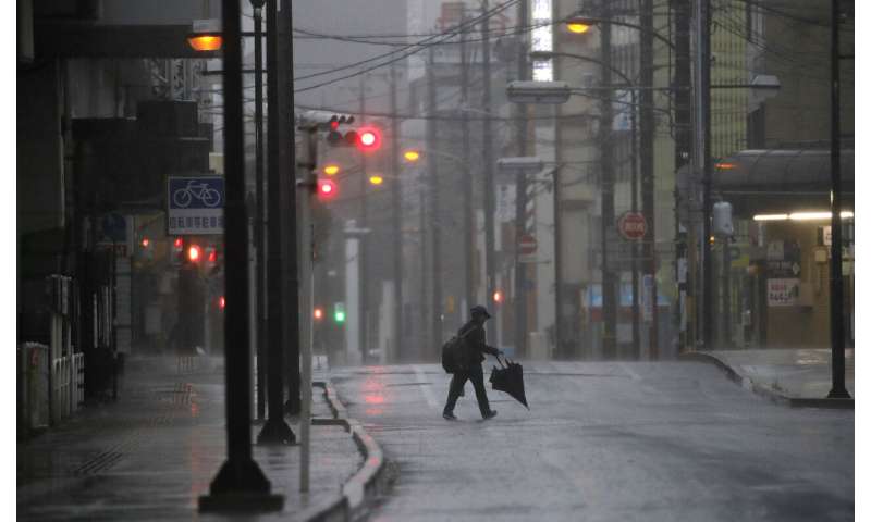 Tokyo area shuts down as powerful typhoon lashes Japan