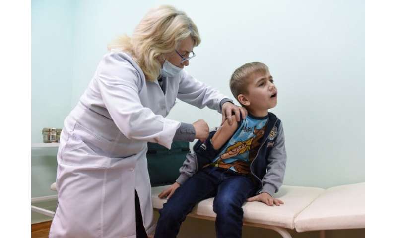 A boy is vaccinated for measles in the village of Lapaivka near the western Ukrainian city of Lviv