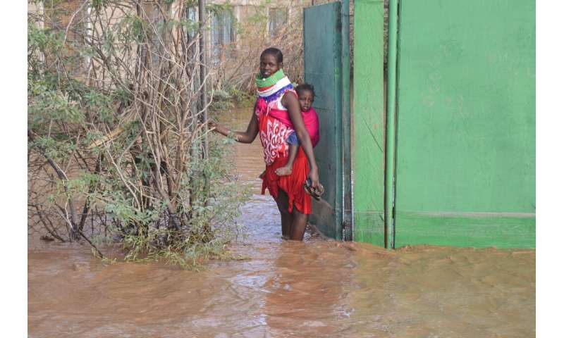 Some parts of northern Kenya received a year's worth of rain in a matter of weeks. A Turkana woman is shown here outside her hom