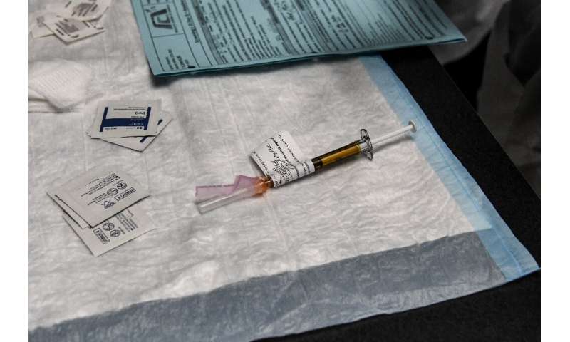 A COVID-19 vaccine can be given to a volunteer at the Research Centers of America in Hollywood, Florida - the clinic is operational