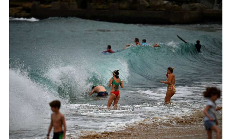 Authorities in Sydney have reopened some beaches for walking, running, swimming and surfing