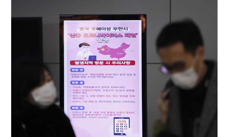 Experts prepare but new China virus not a pandemic yet