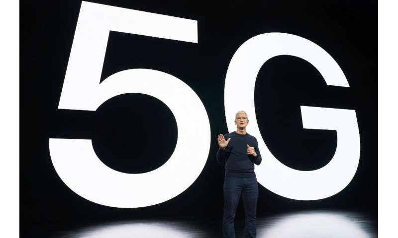 In this photo released by Apple, Apple CEO Tim Cook speaks about 5G during an Apple event at Apple Park in Cupertino, California