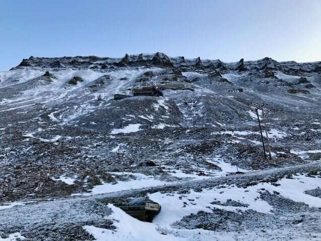 Melting glacier floods Arctic coal mine, highlighting climate change irony