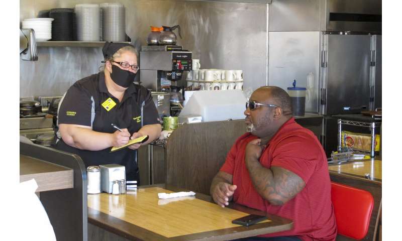 Masks, temperature checks mark 'new normal' at restaurants