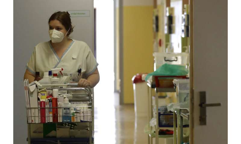 Short of medics as virus surges, central Europe sounds alarm