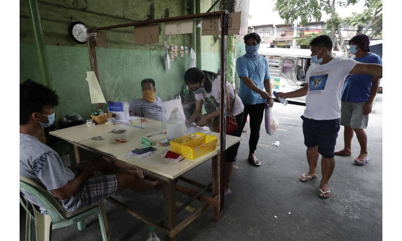 Virus surges in India, Philippines; Australia imposes curfew
