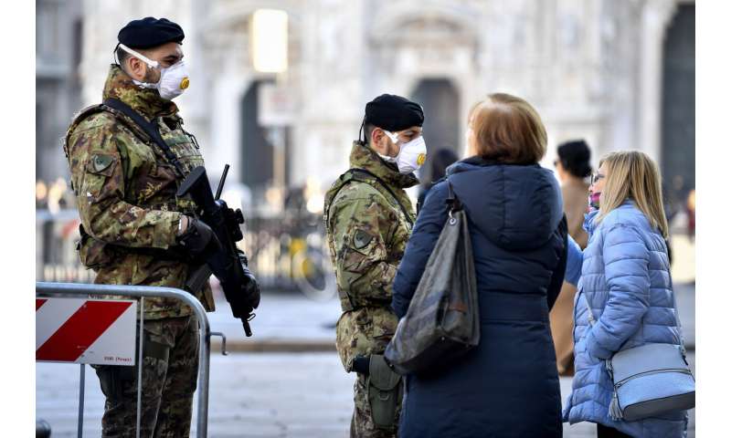 Italy tries to contain virus as isolated towns hunker down