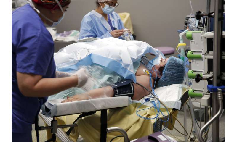 'New start:' Medics juggle surgery backlogs and virus fight