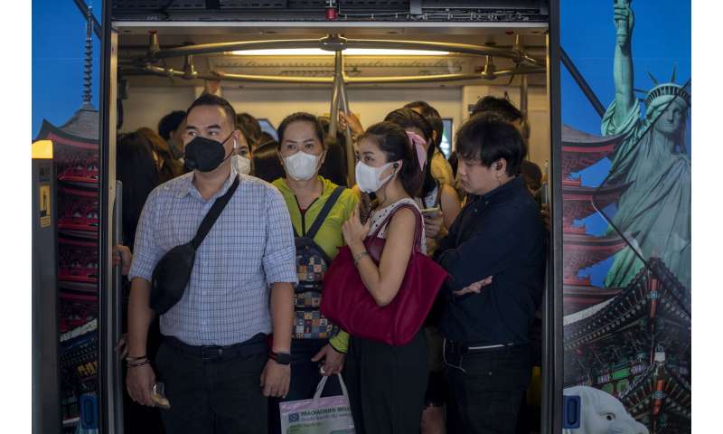 Hong Kong reports virus death as workers strike at hospitals