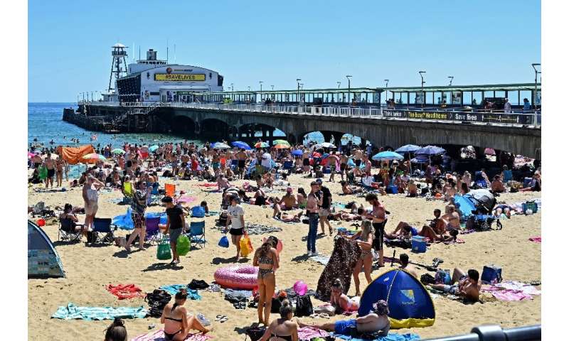 Beachgoers enjoy the sunshine in Bournemouth, southern England—but the crowded shore raised alarm bells for local officials worr